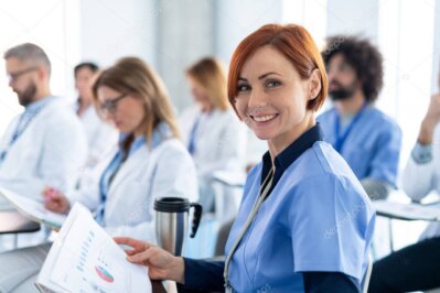 Attendees networking in the exhibition area.